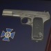 Пистолет ТТ и эмблема СБУ